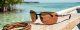 Costa Del Mar Ballast Sunglasses matte black frame copper silver mirror plastic 580P lens